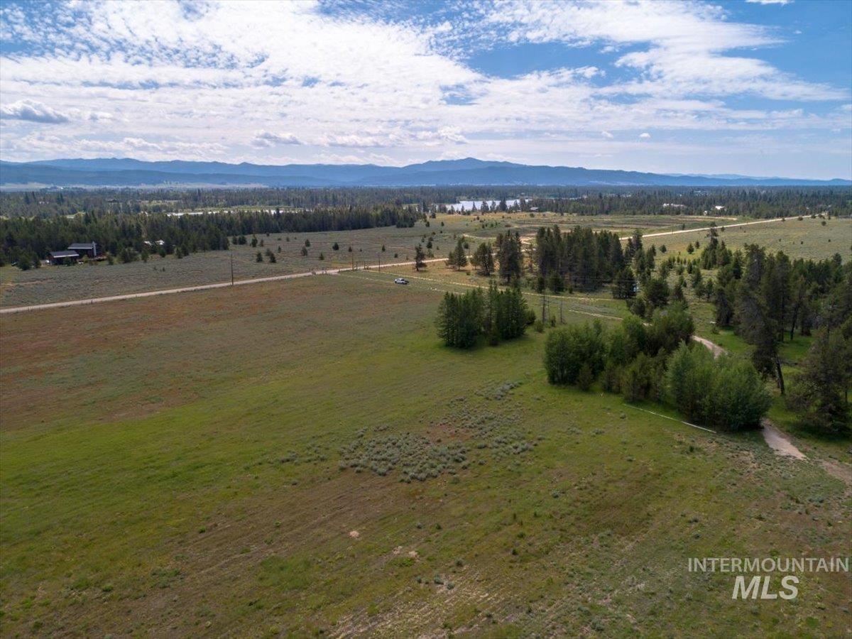 Swc Swc Nisula & Norwood Roads Donnelly, ID 83615 - Photo 12 of 13 Aerial view of sparsely populated area with a mountain backdrop