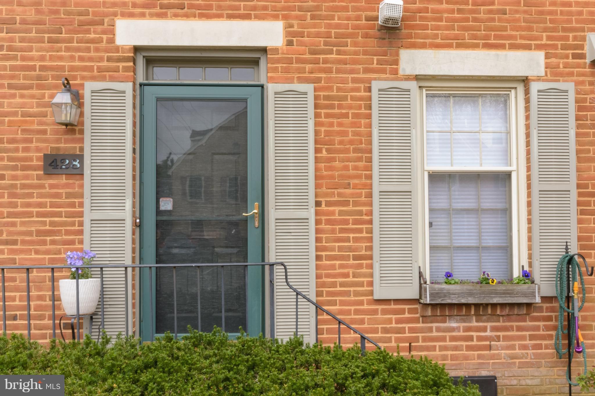 428 West Glebe Road Alexandria, VA 22305 - Photo 2 of 25 a view of a brick house with large windows