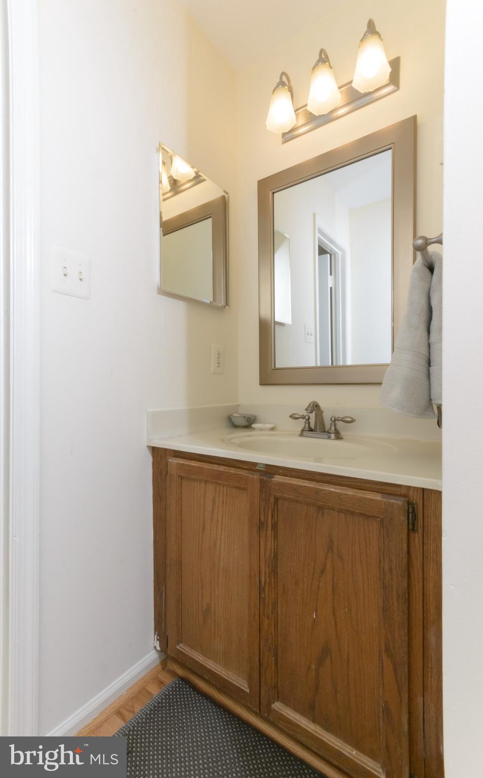 428 West Glebe Road Alexandria, VA 22305 - Photo 10 of 25 a bathroom with a sink and a mirror
