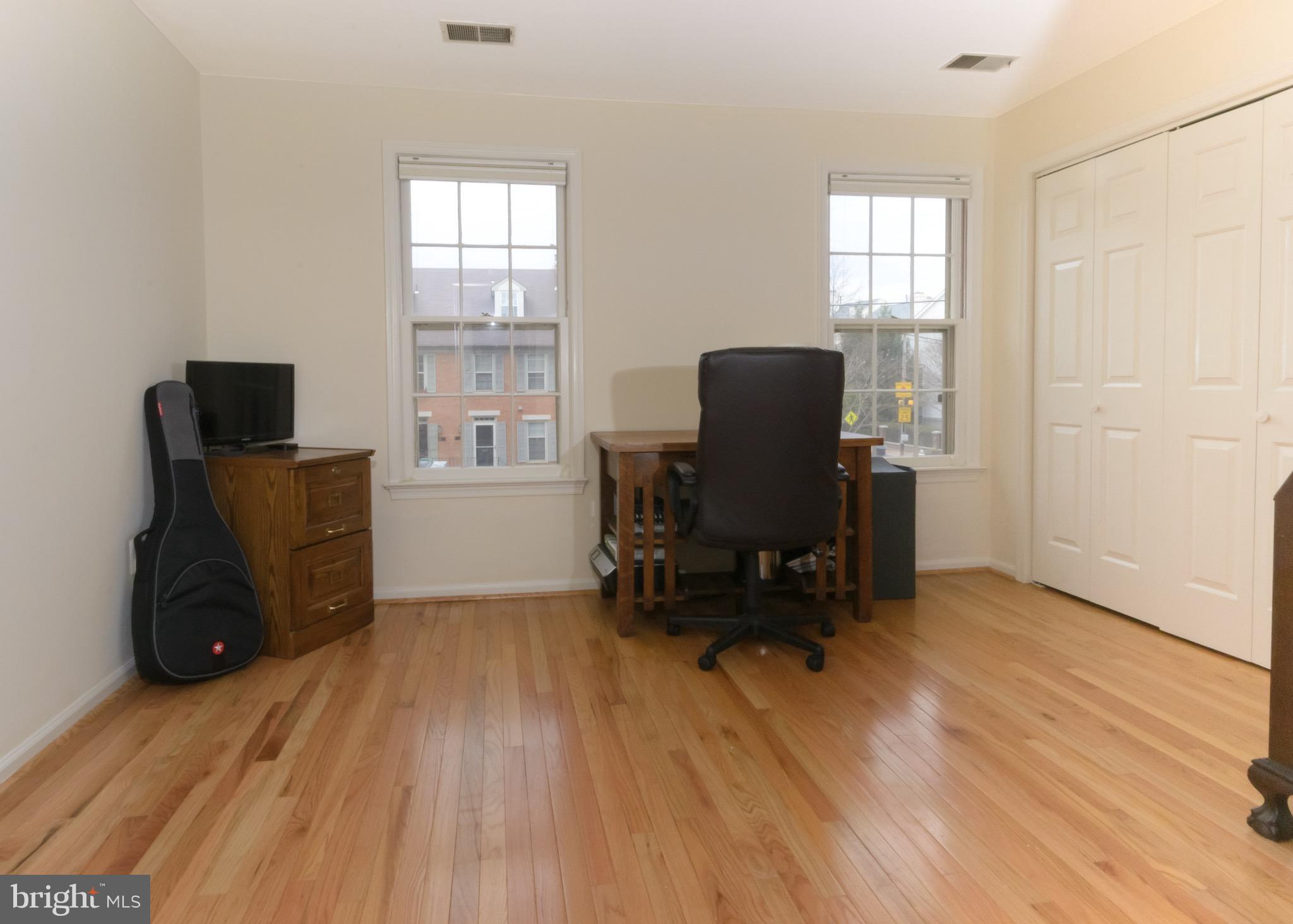 428 West Glebe Road Alexandria, VA 22305 - Photo 11 of 25 a view of workspace with wooden floor windows