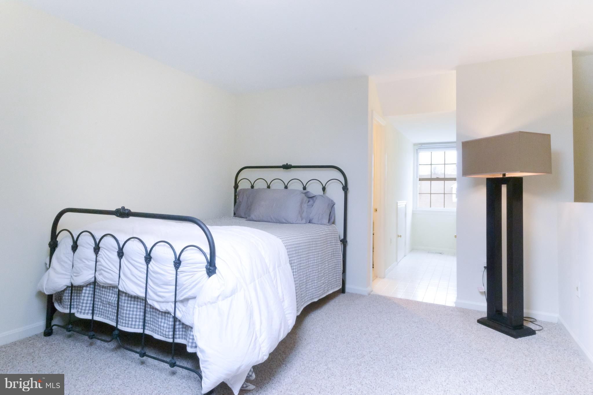 428 West Glebe Road Alexandria, VA 22305 - Photo 14 of 25 a bedroom with a bed and a night stand
