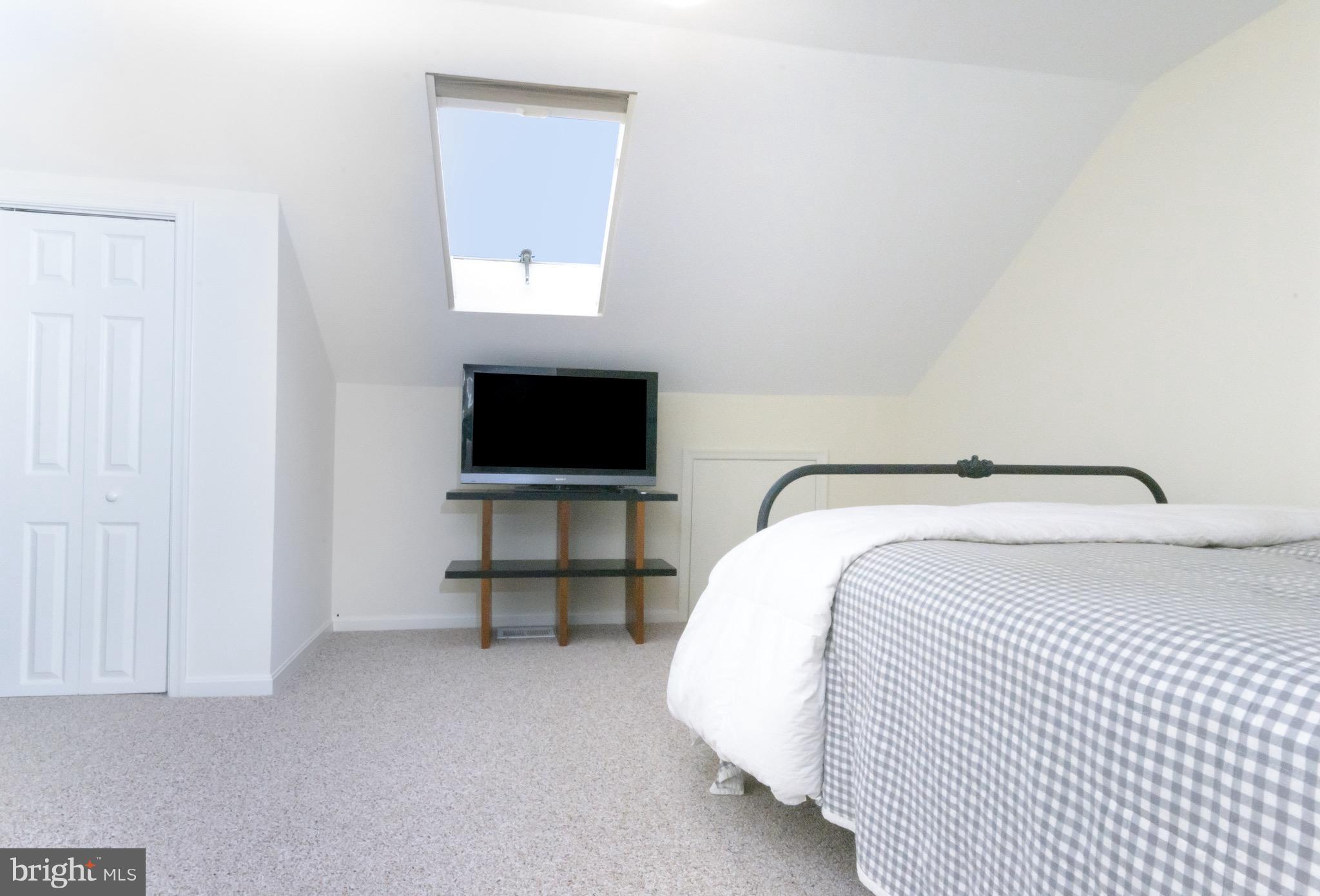 428 West Glebe Road Alexandria, VA 22305 - Photo 15 of 25 a bedroom with a bed and a flat screen tv
