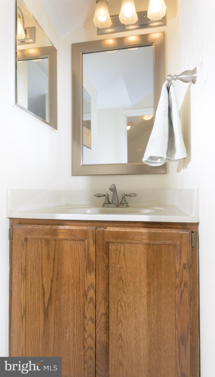 428 West Glebe Road Alexandria, VA 22305 - Photo 17 of 25 a bathroom with a sink and a mirror