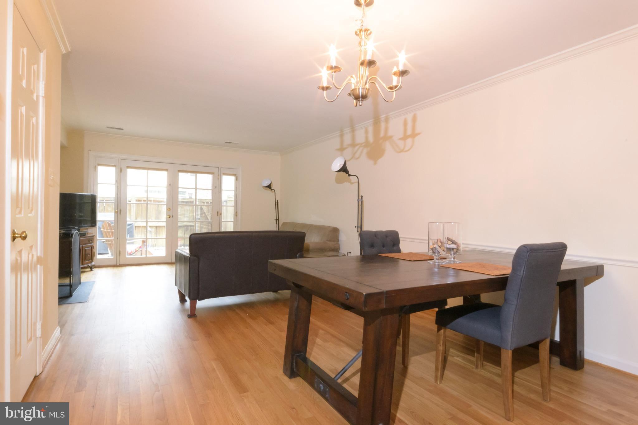 428 West Glebe Road Alexandria, VA 22305 - Photo 25 of 25 a view of a dining room with furniture wooden floor and chandelier