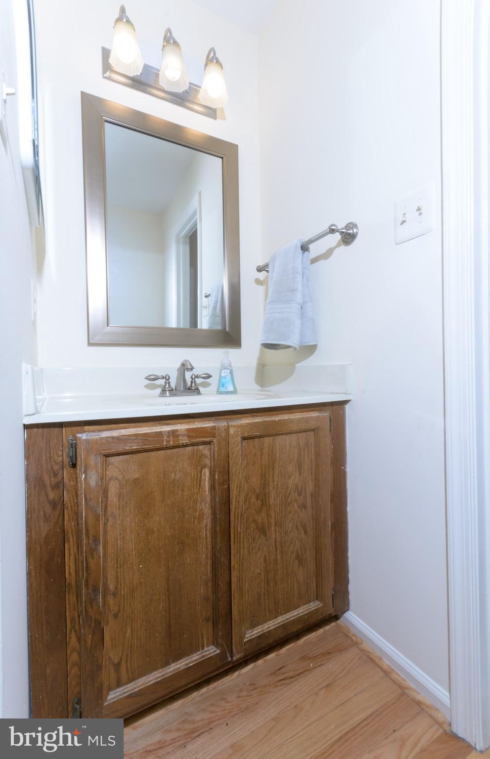 428 West Glebe Road Alexandria, VA 22305 - Photo 8 of 25 a bathroom with a sink vanity and a mirror