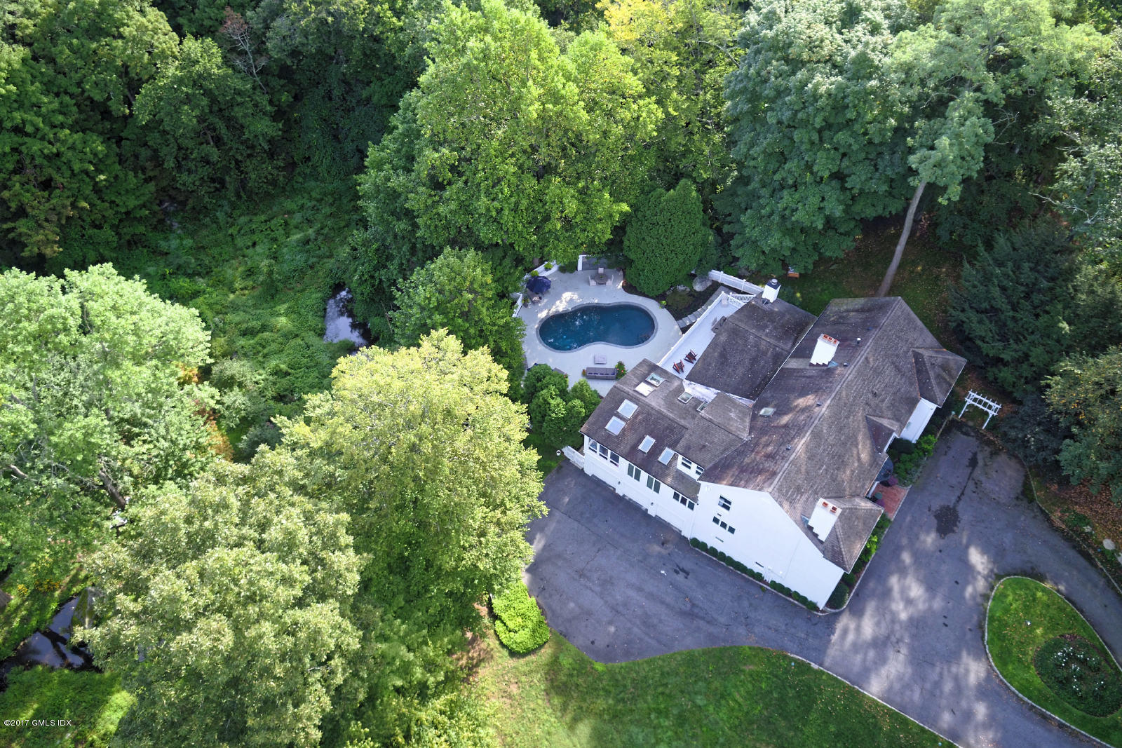 25 Windabout Drive Greenwich, CT 06831 - Photo 20 of 31 an aerial view of a house with a yard