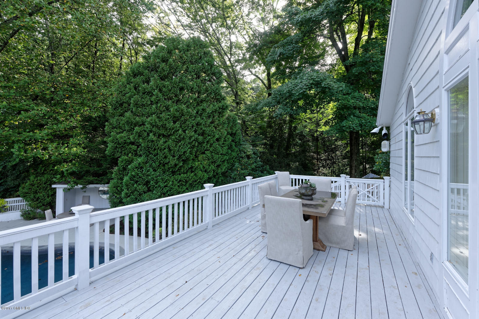 25 Windabout Drive Greenwich, CT 06831 - Photo 22 of 31 a view of roof deck with furniture and trees