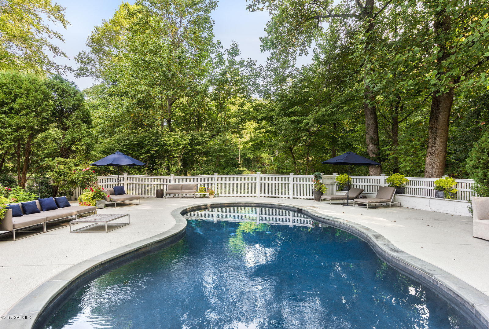 25 Windabout Drive Greenwich, CT 06831 - Photo 23 of 31 a view of a swimming pool with a patio
