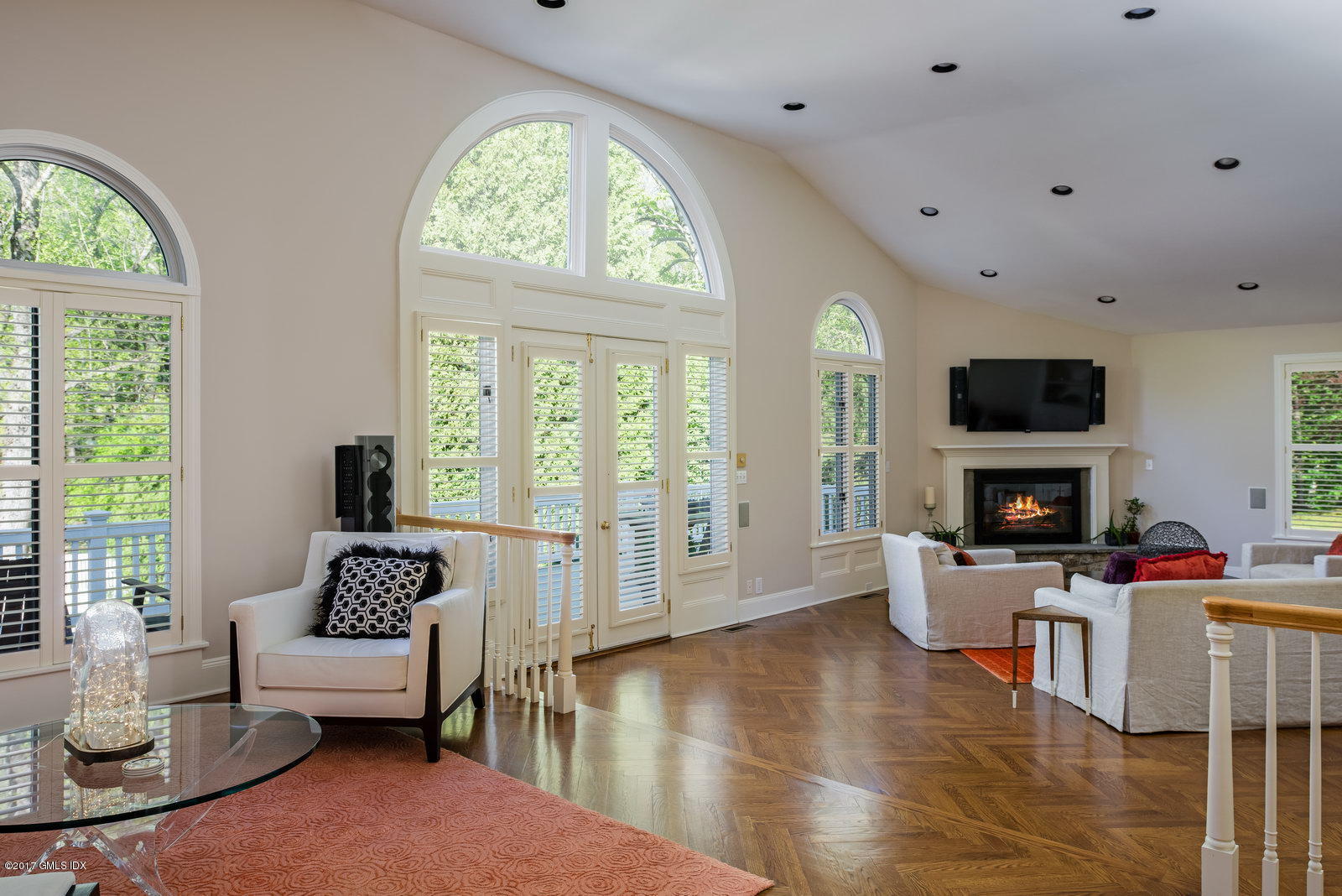 25 Windabout Drive Greenwich, CT 06831 - Photo 6 of 31 a living room with fireplace furniture and a flat screen tv
