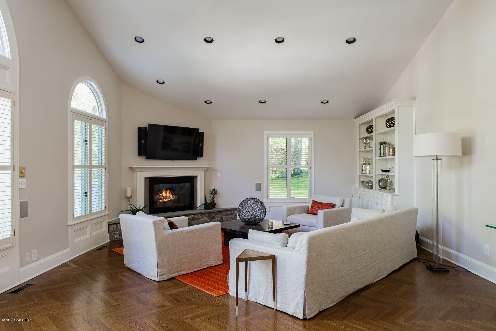 25 Windabout Drive Greenwich, CT 06831 - Photo 7 of 31 a living room with fireplace furniture and a flat screen tv