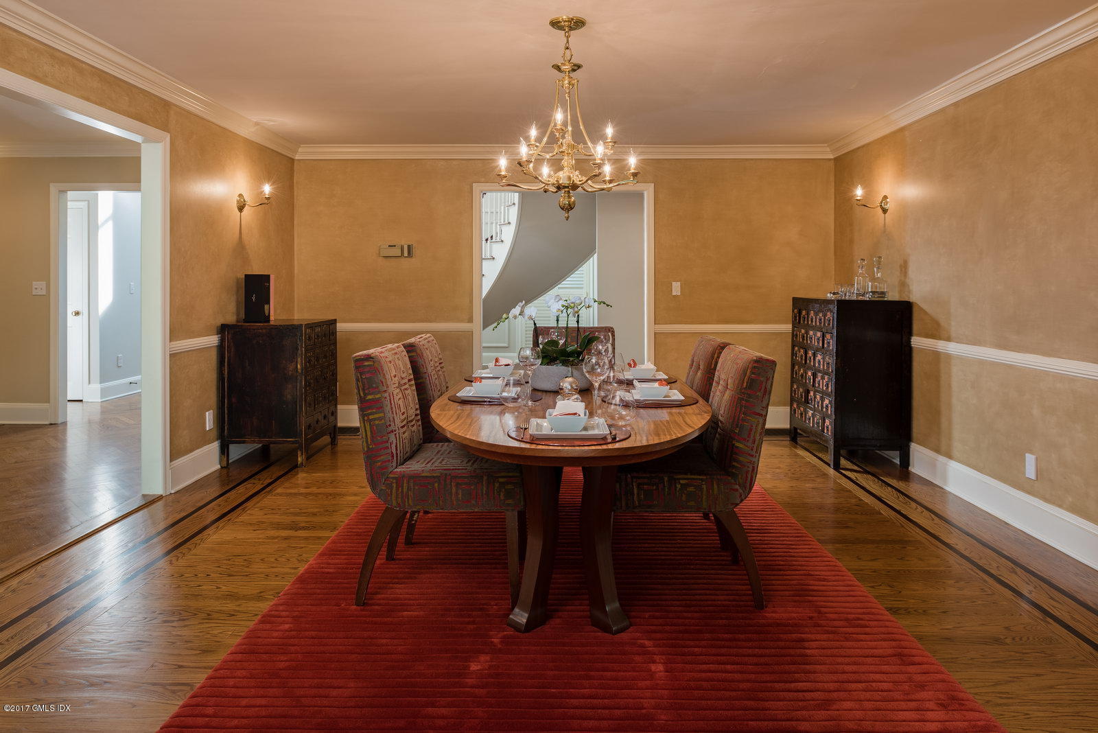 25 Windabout Drive Greenwich, CT 06831 - Photo 10 of 31 a dining room with furniture a chandelier and wooden floor