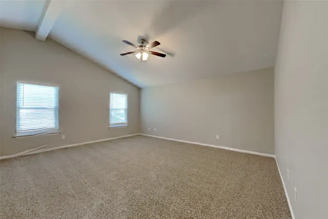 a bathroom with a bathtub and a window