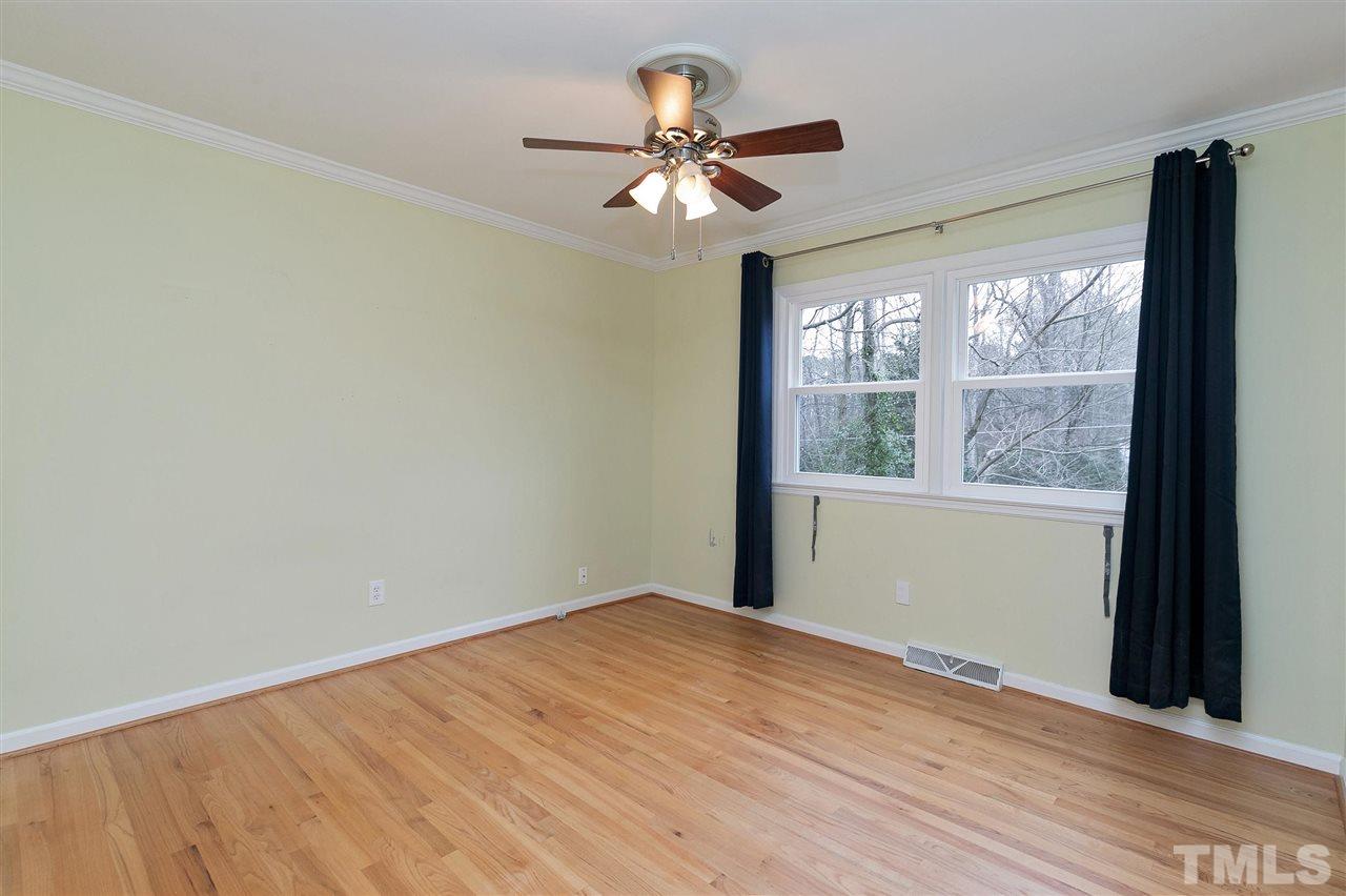 6509 Wrenwood Avenue Raleigh, NC 27607 - Photo 12 of 29 a view of a room with a large window with wooden floor