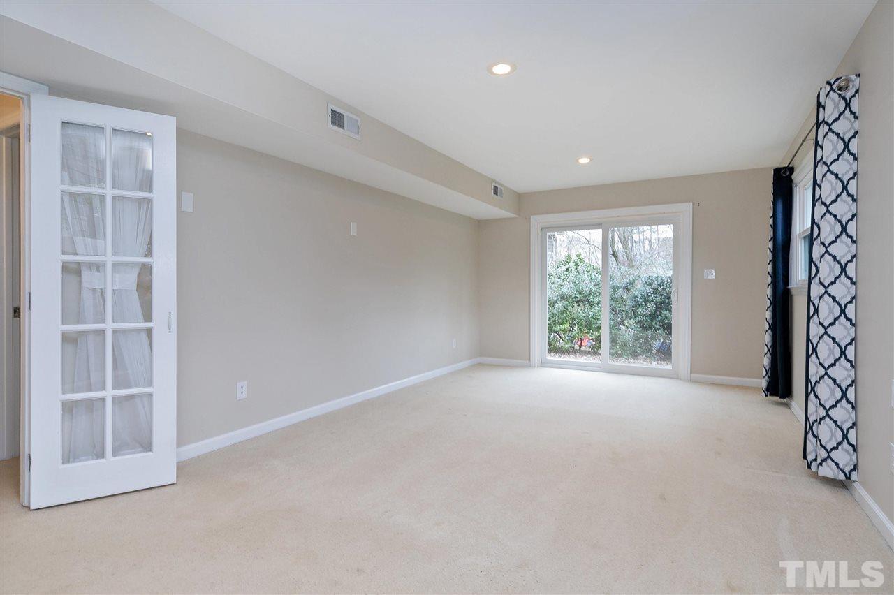 6509 Wrenwood Avenue Raleigh, NC 27607 - Photo 16 of 29 an empty room with windows