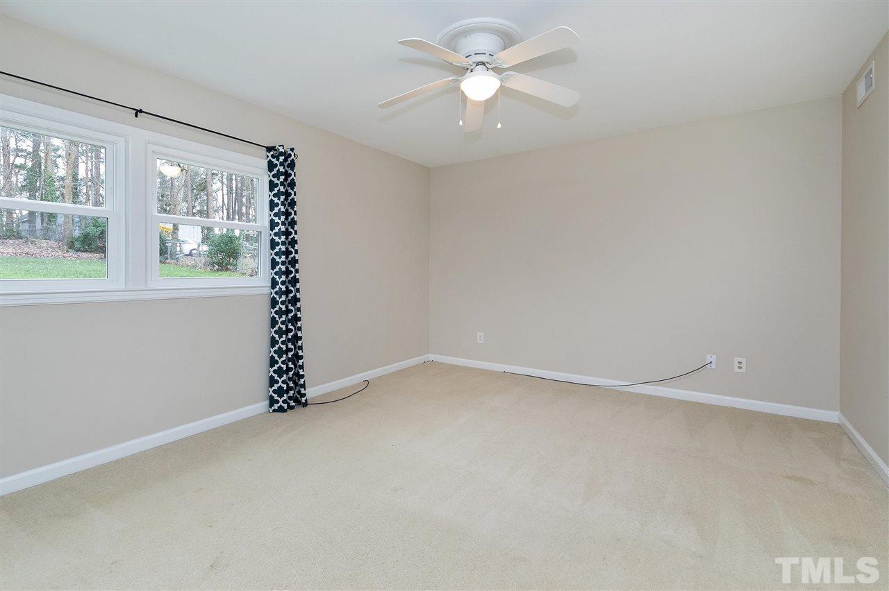 6509 Wrenwood Avenue Raleigh, NC 27607 - Photo 18 of 29 an empty room with a window