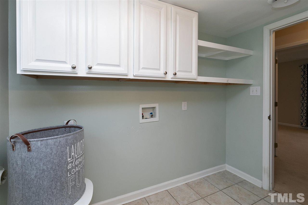 6509 Wrenwood Avenue Raleigh, NC 27607 - Photo 20 of 29 a close view of wooden cabinets