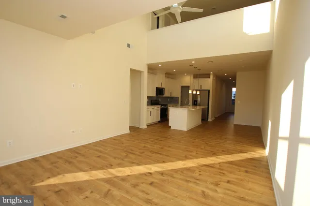 a view of a kitchen with a refrigerator