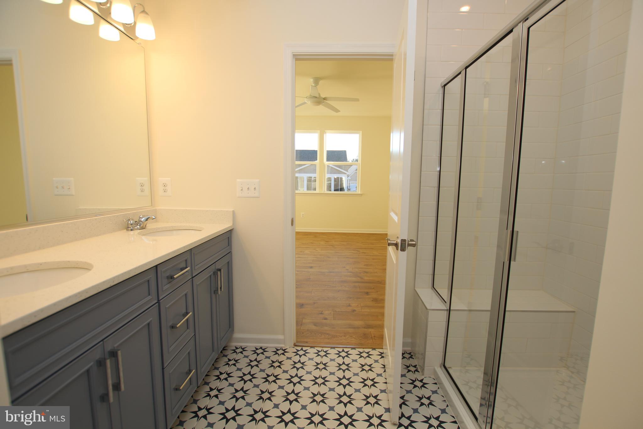 390 Scranton Lane Ocean View, DE 19970 - Photo 8 of 14 a bathroom with a sink and a shower