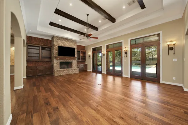 a view of room with ceiling fan and window