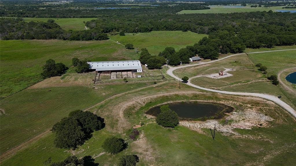 377 Private Road 3249, Unit ARENA Decatur, TX 76234 - Photo 39 of 40 a view of a golf course with a garden