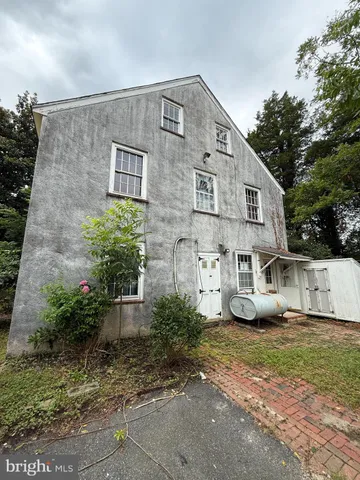a view of a backyard with a tree