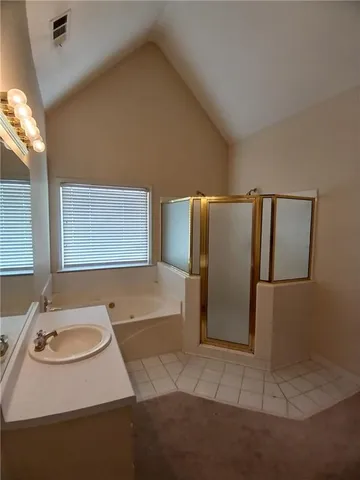 a living room with a couch and a walk in closet