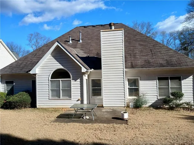 a backyard of a house with yard and lake view