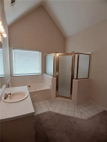 an empty room that has a window in it