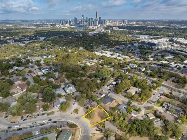 an aerial view of residential building with parking space
