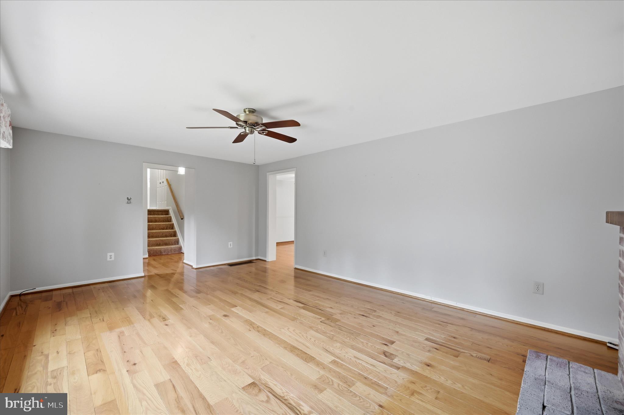 244 High Banks Road Stephenson, VA 22656 - Photo 10 of 45 an empty room with wooden floor and ceiling fan
