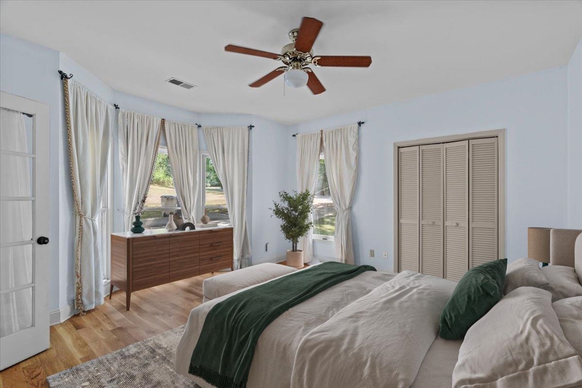 8485 Highway 196 Collierville, TN 38017 - Photo 12 of 34 a bedroom with a bed and a chandelier