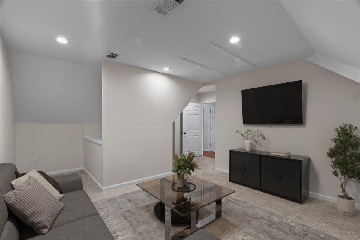 8485 Highway 196 Collierville, TN 38017 - Photo 16 of 34 a living room with furniture and a flat screen tv