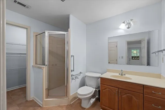 a bathroom with a toilet sink and shower