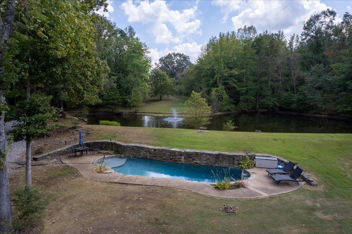 8485 Highway 196 Collierville, TN 38017 - Photo 27 of 34 an aerial view of a house with a yard table and chairs