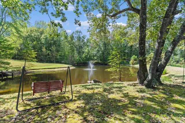 a backyard of a house with lots of green space