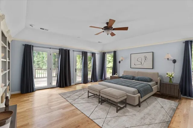 a bedroom with a large bed and a window