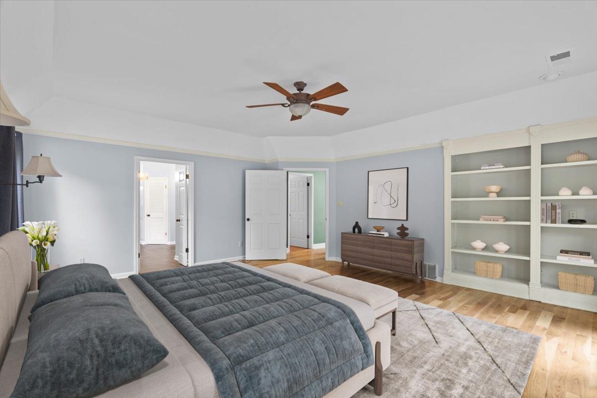 8485 Highway 196 Collierville, TN 38017 - Photo 9 of 34 a bedroom with a bed and dresser with mirror