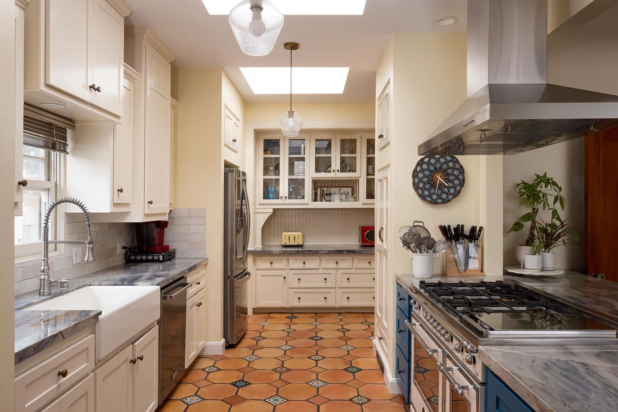 4192 Rochester Road San Diego, CA 92116 - Photo 11 of 49 a kitchen with stainless steel appliances granite countertop a stove and a sink