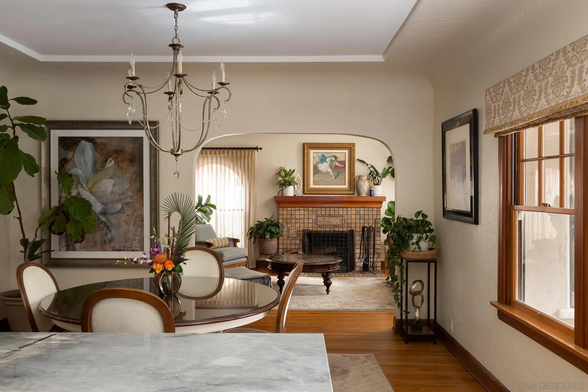 4192 Rochester Road San Diego, CA 92116 - Photo 13 of 49 a living room with furniture a fireplace and a chandelier