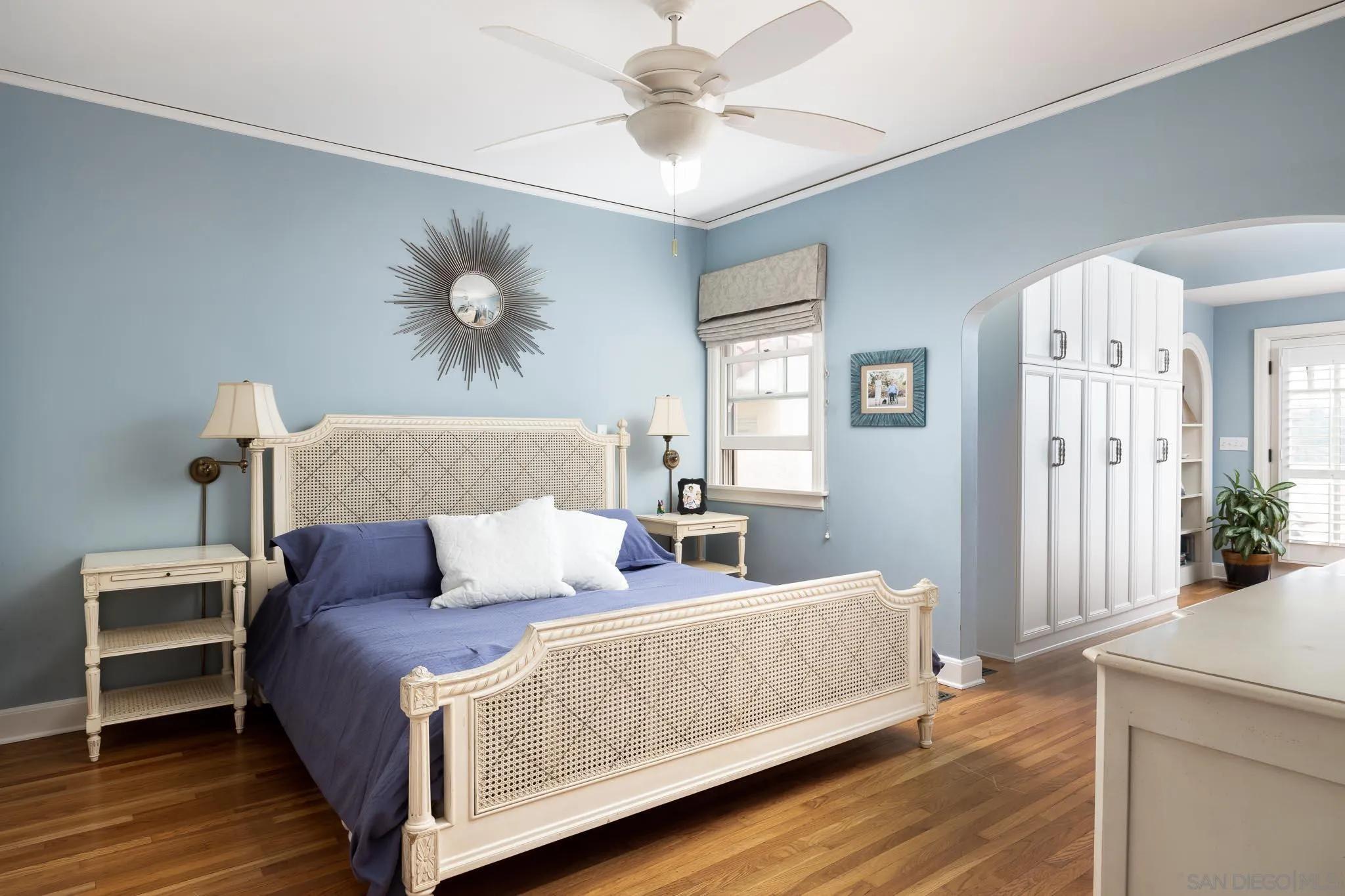 4192 Rochester Road San Diego, CA 92116 - Photo 16 of 49 a bedroom with bed and a chandelier