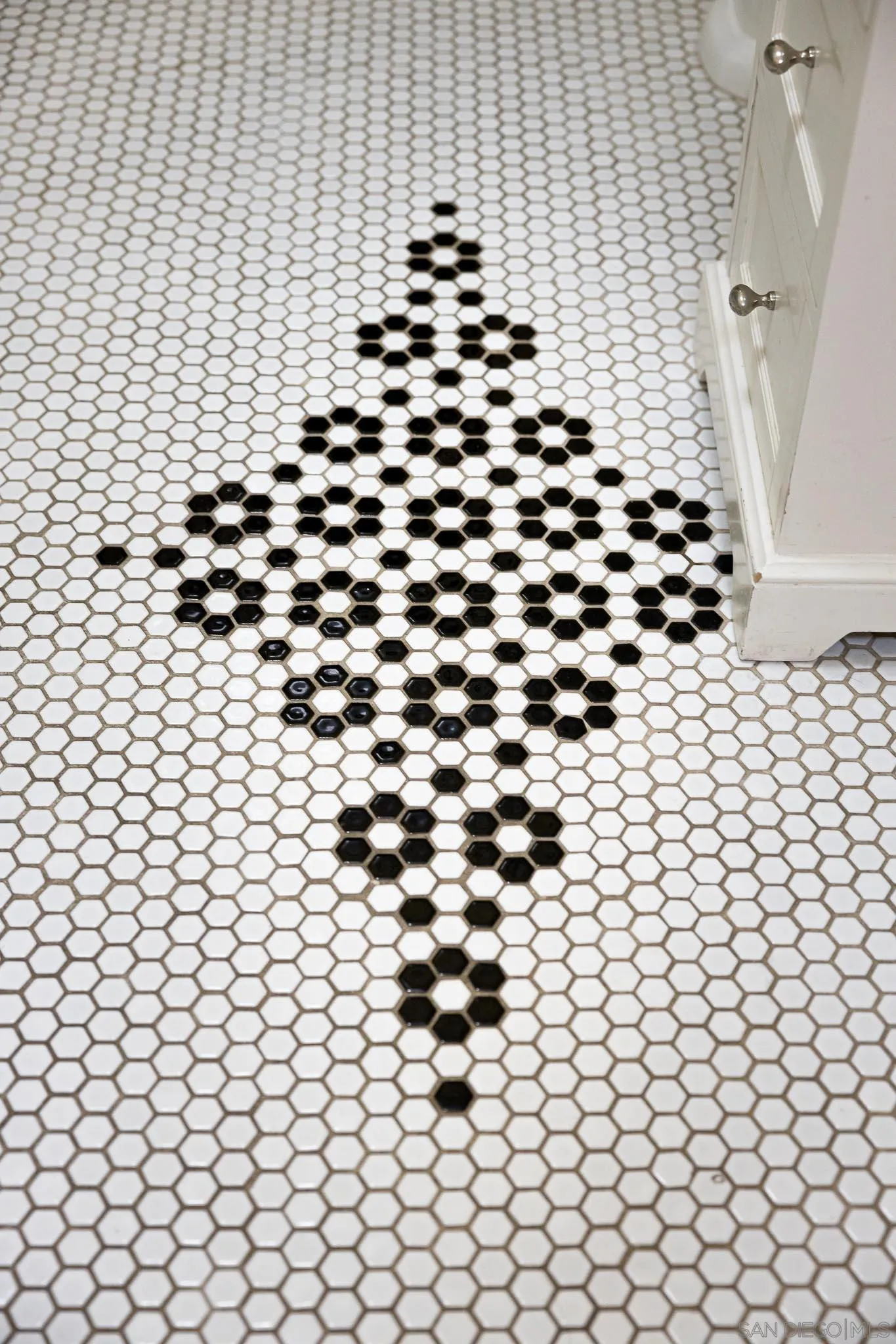 4192 Rochester Road San Diego, CA 92116 - Photo 23 of 49 a bathroom with a black and white checkered floor