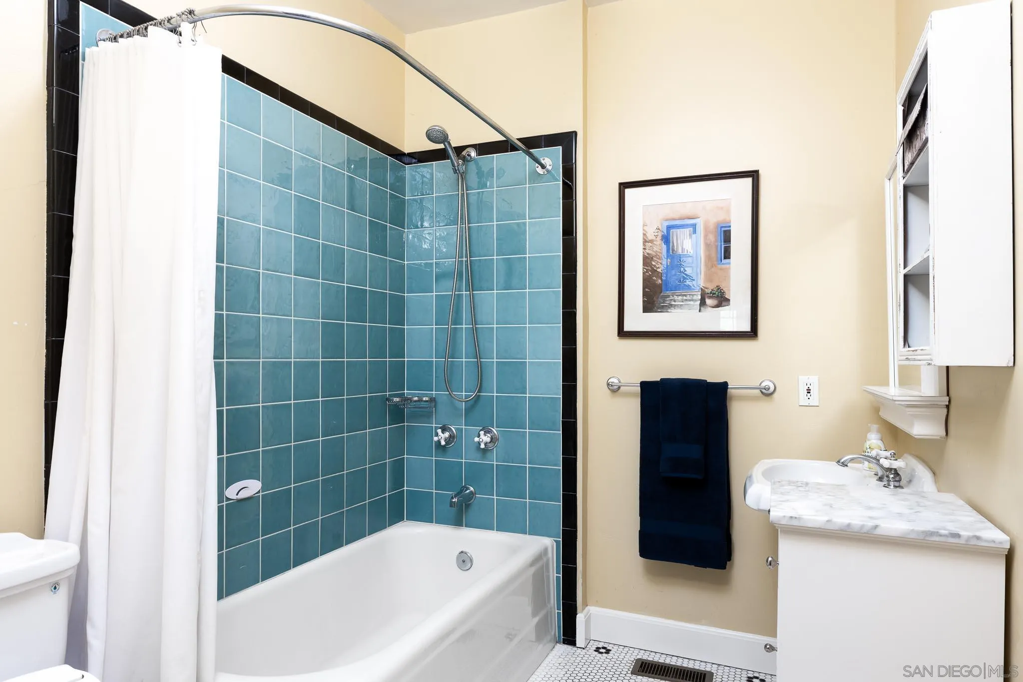 4192 Rochester Road San Diego, CA 92116 - Photo 24 of 49 a bathroom with a bathtub and shower