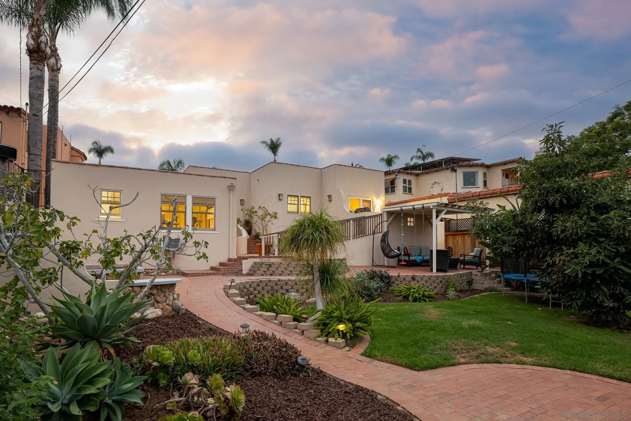 4192 Rochester Road San Diego, CA 92116 - Photo 26 of 49 a front view of a house with garden