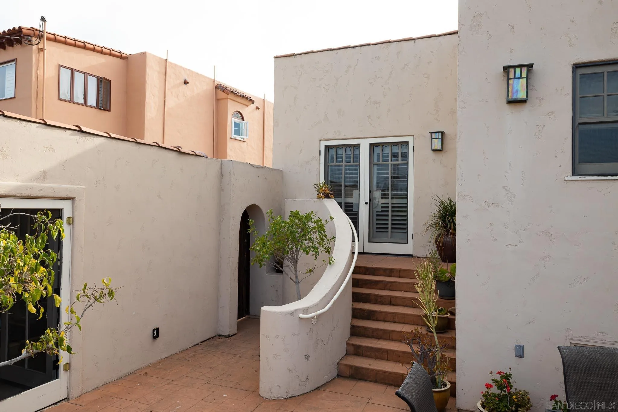 4192 Rochester Road San Diego, CA 92116 - Photo 28 of 49 front view of a house with potted plants