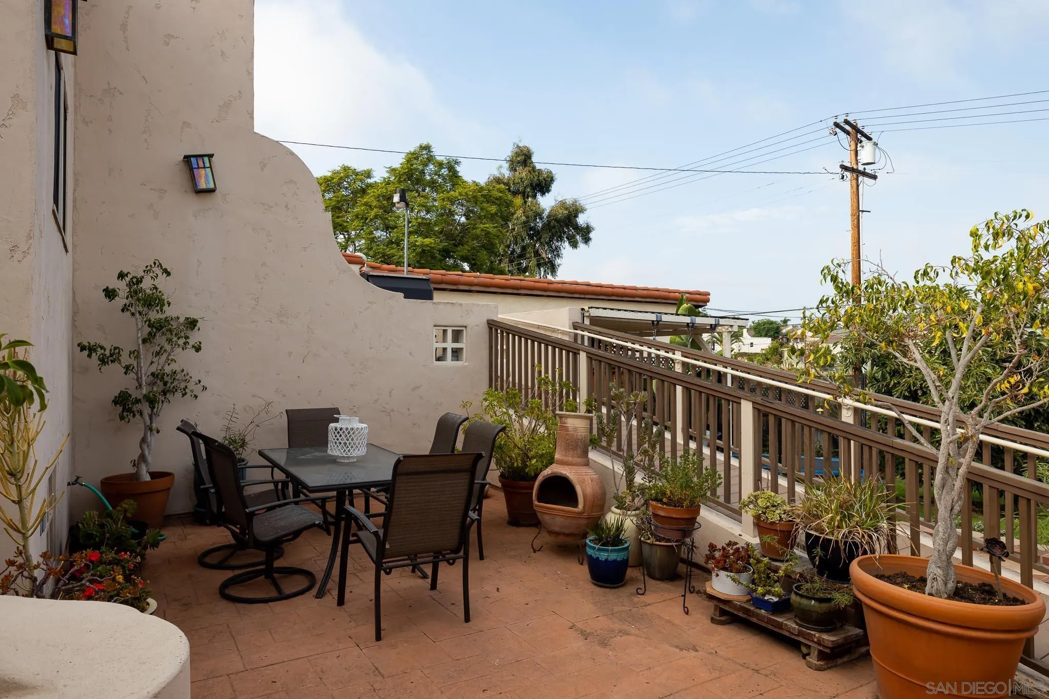 4192 Rochester Road San Diego, CA 92116 - Photo 31 of 49 a terrace with outdoor seating and potted plants