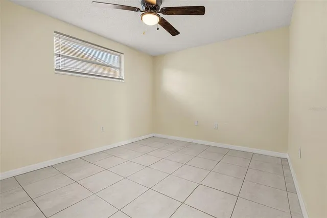 a bathroom with a sink a toilet and shower curtain
