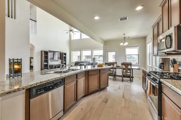 a kitchen with lots of counter top space and appliances