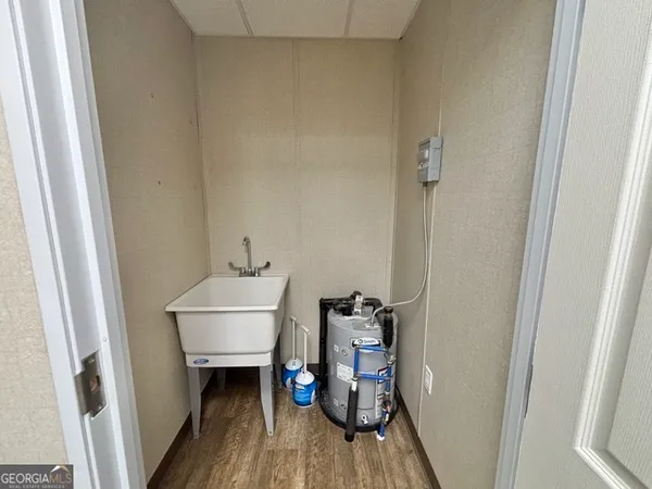 a bathroom with a sink a mirror and a shower