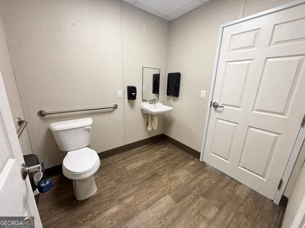 a bathroom with a toilet and a sink