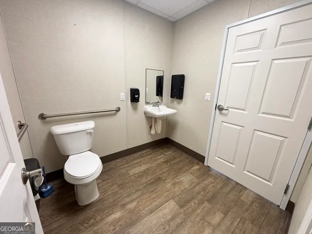 a bathroom with a toilet and a sink